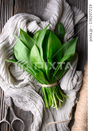 Wild garlic leaves with scissors and twine Wild garlic leaves with scissors and twine 136207219