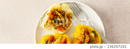 Enjoy a delicious and wholesome meal with stuffed bell peppers filled with quinoa, lentils, and vegetables, ideal for a balanced, healthy breakfast or lunch, banner Enjoy a delicious and wholesome meal with stuffed bell peppers filled with quinoa, lentils, and vegetables, ideal for a balanced, healthy breakfast or lunch, banner 136207281