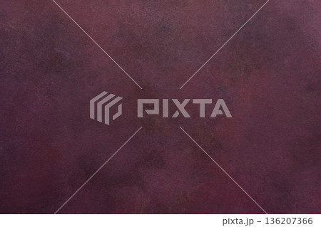 A dark maroon surface exhibits a subtle texture. Light and dark variations create a smooth, blended effect over the entire area 136207366