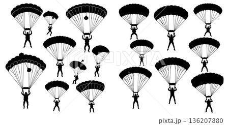 Silhouettes of skydivers with parachutes descending against a plain backdrop 136207880