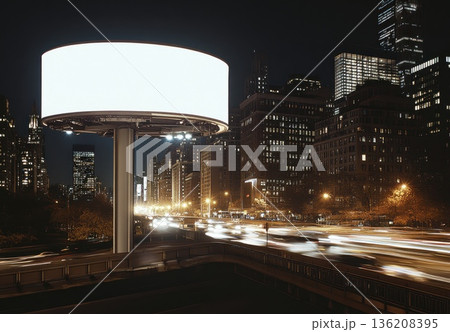 Blank White Billboard at Night in Modern City with Traffic Light Trails 136208395
