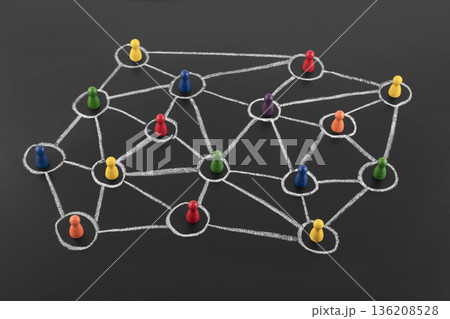 Colorful group of people figures connected with chalk on blackboard. Diversify people and social network concept 136208528