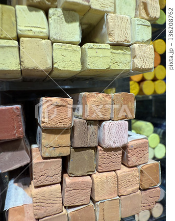 Pastel chalks stacked in various shades of earthy tones for artistic creativity and design background Pastel chalks stacked in various shades of earthy tones for artistic creativity and design background 136208762