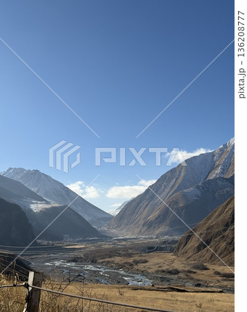 Majestic mountain landscape with clear blue sky, ideal for backgrounds and nature concepts Majestic mountain landscape with clear blue sky, ideal for backgrounds and nature concepts 136208777