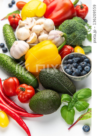 Fresh organic vegetables and fruit creating healthy food background 136209559