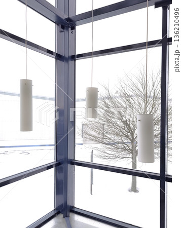 Modern cylindrical pendant lights in panoramic glazing 136210496