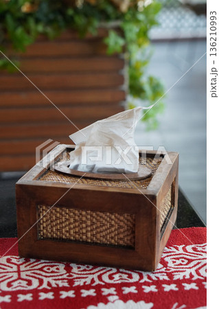 front view the tissues are in a rectangular wooden box. on the red carpet On the black marble table, nature background, object, decor, copy space 136210993