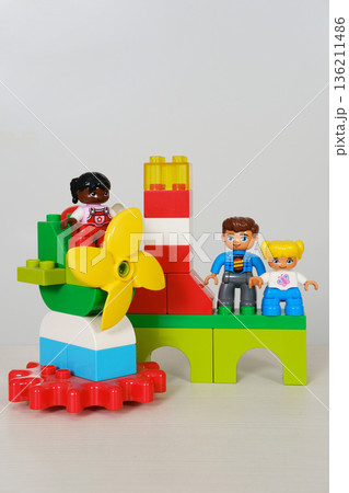 Colorful children's toy building set featuring playful figures and vibrant blocks, showcasing creativity and imagination with copy space for design purposes Colorful children's toy building set featuring playful figures and vibrant blocks, showcasing creativity and imagination with copy space for design purposes 136211486