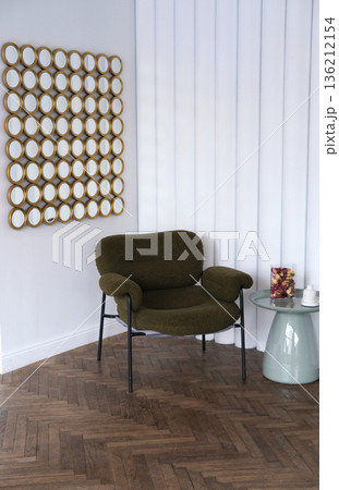 Minimalist interior featuring a cozy green chair and decorative mirrors on the wall, creating a serene atmosphere with ample copy space for design elements Minimalist interior featuring a cozy green chair and decorative mirrors on the wall, creating a serene atmosphere with ample copy space for design elements 136212154