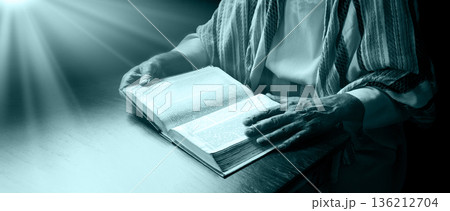 Old man reading a big book Old man reading a big book 136212704