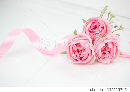 Two pink roses and ribbons isolated on white background, Valentines day 136213745