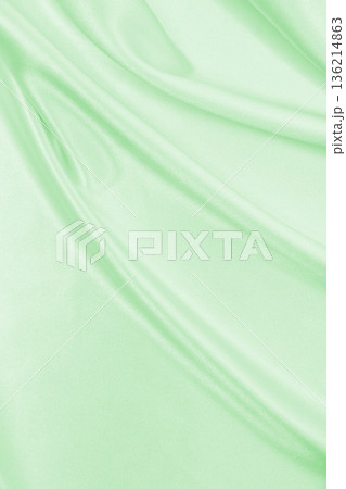 Smooth elegant green silk or satin luxury cloth texture as abstract background. Luxurious background design 136214863
