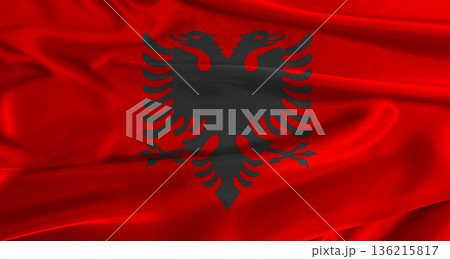 Flag of Albania with fabric textured background. Close up of National flag of Albania with realistic texture Flag of Albania with fabric textured background. Close up of National flag of Albania with realistic texture 136215817