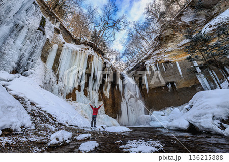 Spectacular Frozen Waterfall and Icicles in Winter Spectacular Frozen Waterfall and Icicles in Winter 136215888