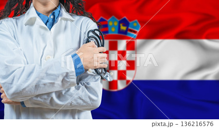 Healthcare professional with Croatia flag background. Professional doctor holding stethoscope on Croatia flag background 136216576