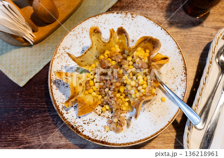 Grey stewed peas with cracklings on a plate Grey stewed peas with cracklings on a plate 136218961