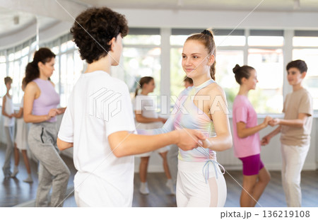 Teenage boy and girl dancing waltz Teenage boy and girl dancing waltz 136219108