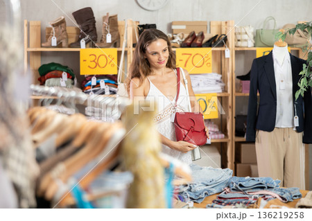 Woman buying bag on sale 136219258