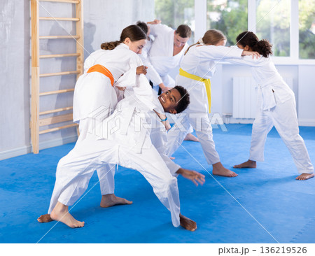 Boy and girl training judo technique Boy and girl training judo technique 136219526