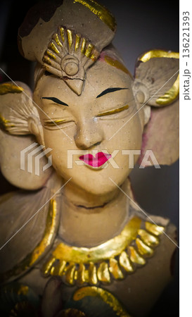 serene Bali dancer ceramic bust featuring closed eyes, bright lips, and gold embellishments. Ideal decorative sculpture for home, temple, or gallery displays, emphasizing art, culture, and craft serene Bali dancer ceramic bust featuring closed eyes, bright lips, and gold embellishments. Ideal decorative sculpture for home, temple, or gallery displays, emphasizing art, culture, and craft 136221393