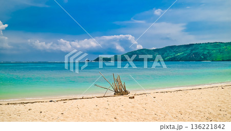 Beautiful view of white sand beach on tropical island, Mandalika beach, Lombok, Indonesia Beautiful view of white sand beach on tropical island, Mandalika beach, Lombok, Indonesia 136221842