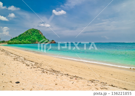 Beautiful view of white sand beach on tropical island, Mandalika beach, Lombok, Indonesia Beautiful view of white sand beach on tropical island, Mandalika beach, Lombok, Indonesia 136221855