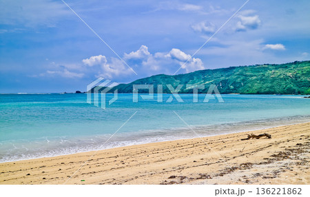 Beautiful view of white sand beach on tropical island, Mandalika beach, Lombok, Indonesia Beautiful view of white sand beach on tropical island, Mandalika beach, Lombok, Indonesia 136221862