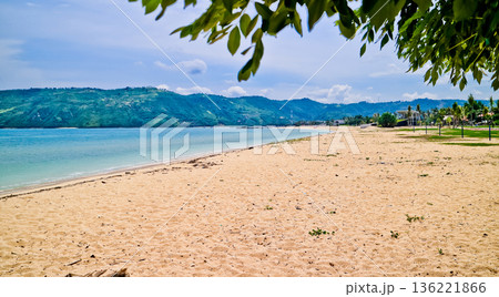 Beautiful view of white sand beach on tropical island, Mandalika beach, Lombok, Indonesia Beautiful view of white sand beach on tropical island, Mandalika beach, Lombok, Indonesia 136221866