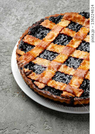 Baking a dessert with a filling and crust on a table in a kitchen setting Baking a dessert with a filling and crust on a table in a kitchen setting 136224614