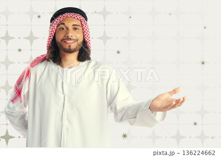 Man welcomes guests during Ramadan celebration in a festive setting Man welcomes guests during Ramadan celebration in a festive setting 136224662