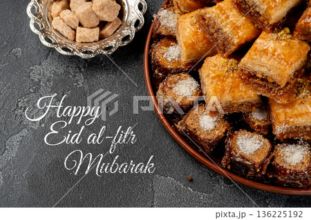 Baklava and sweets shared during Eid al-Fitr celebration in a home setting Baklava and sweets shared during Eid al-Fitr celebration in a home setting 136225192