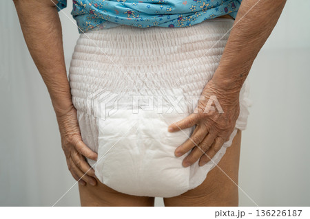 Asian senior woman patient wearing incontinence diaper. Asian senior woman patient wearing incontinence diaper. 136226187