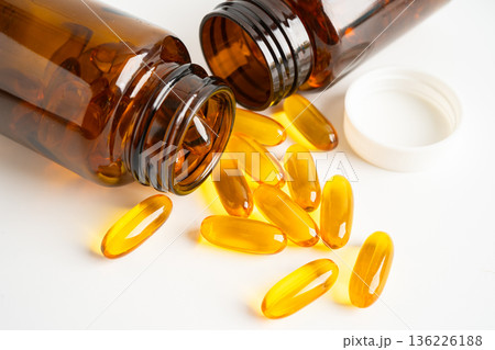 Fish oil Omega 3 capsules vitamin with EPA and DHA isolated on white background. Fish oil Omega 3 capsules vitamin with EPA and DHA isolated on white background. 136226188