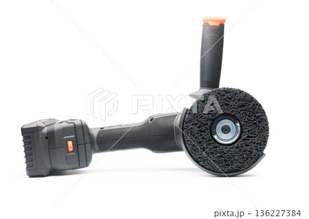 Cordless angle grinder for cutting, grinding, and polishing. On a white background in isolation. 136227384