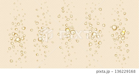 Sparkling champagne bubbles rising in golden drink 136229168