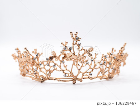 Ornate Gold Crown with Crystals on White Background 136229467