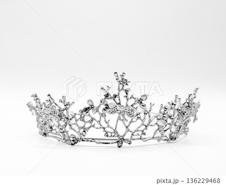 Ornate Silver Crown with Crystals on White Background 136229468