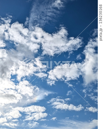White fluffy clouds on a beautiful clear blue sky 136230168