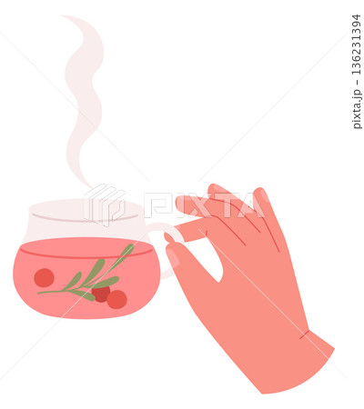 Hand hold hot herbal tea with winter berries Hand hold hot herbal tea with winter berries 136231394