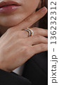 Woman's hand with beautiful ring touching her delicate face skin 136232312