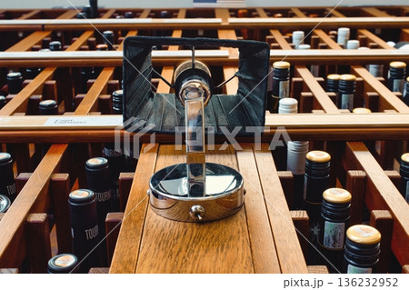 Close-up of a wine rack on the wall full of red wine bottles Close-up of a wine rack on the wall full of red wine bottles 136232952