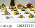 A collection of gold rings in a display box at a jewellery shop 136233540