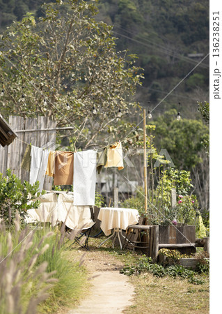 Clothes lined up to dry in the sun. Clothes lined up to dry in the sun. 136238251