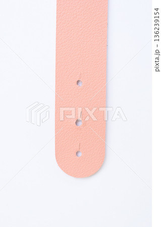 light pink leather strap isolated on white background 136239154