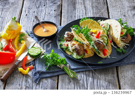 Lamb meatball tacos with fresh veggies on a plate Lamb meatball tacos with fresh veggies on a plate 136239967