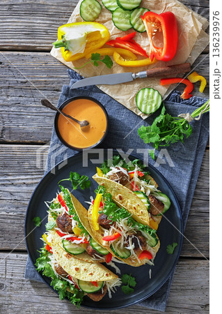 Lamb meatball tacos with fresh veggies on a plate 136239976