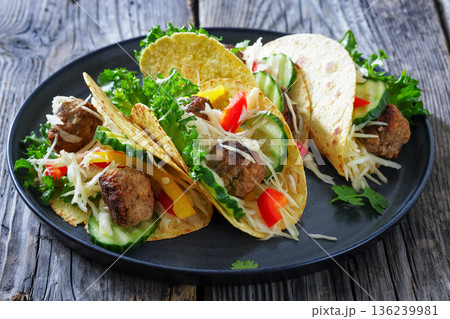 Lamb meatball tacos with fresh veggies on a plate 136239981