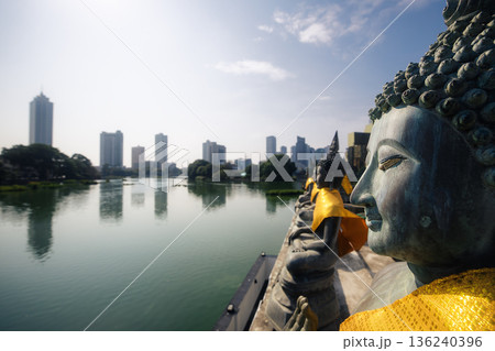 Buddhist temple on lake in Colombo 136240396
