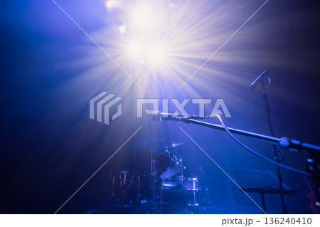 Empty concert stage with microphone in selective focus Empty concert stage with microphone in selective focus 136240410