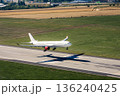 Airplane landing on airport runway 136240425